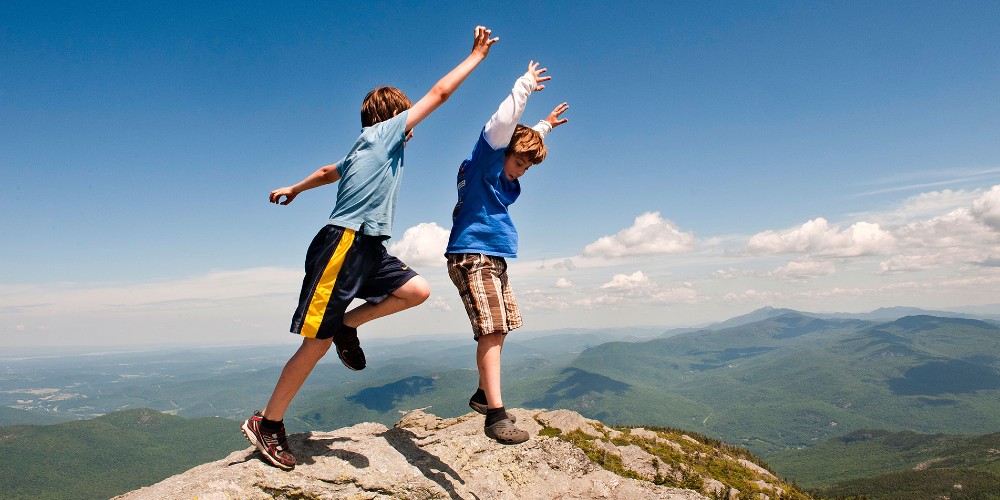 camels-hump-kids-jumping-mountain-vacation-vermont