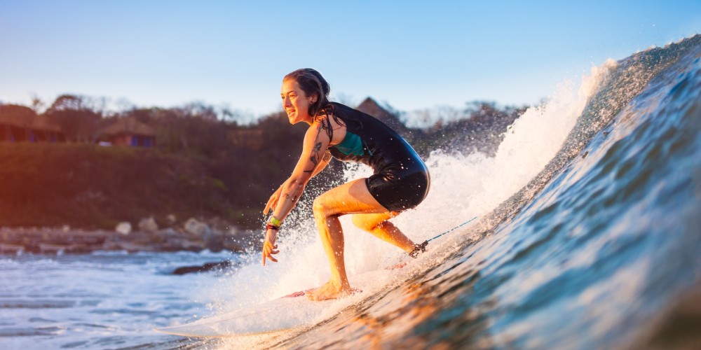 teenage-girl-learning-to-surf-hawaii