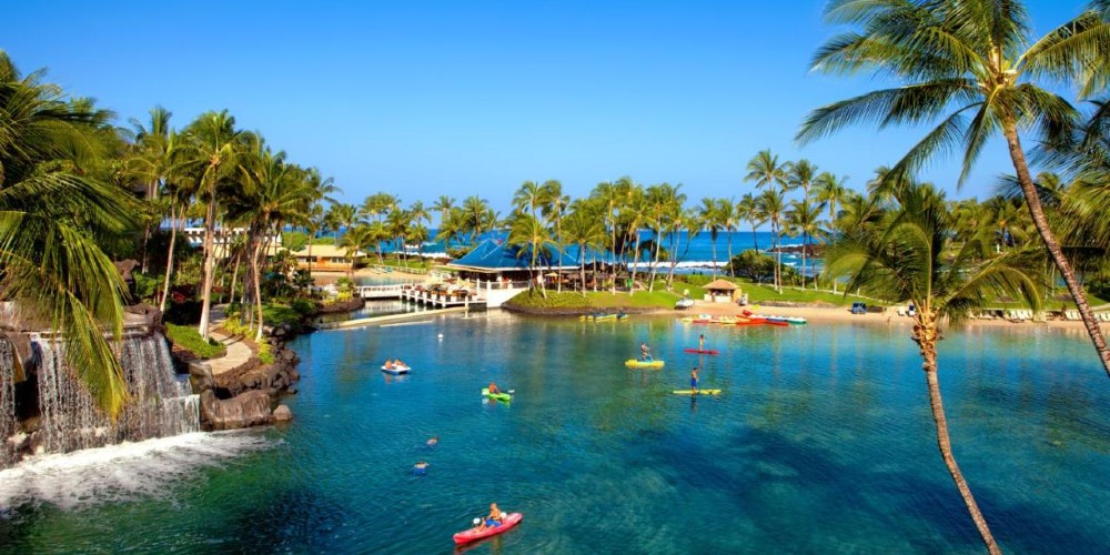 hilton-waikoloa-village-kayaking-on-resort-ocean-fed-lagoon-warm-winter-getaways-big-island-hawaii