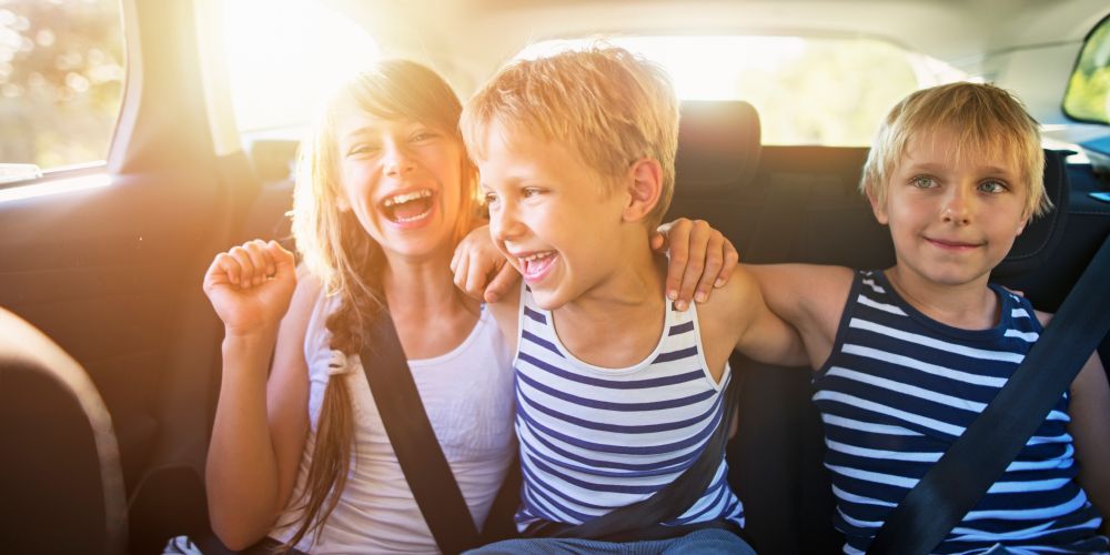 family vacation Instagram captions kids laughing in car on family road trip