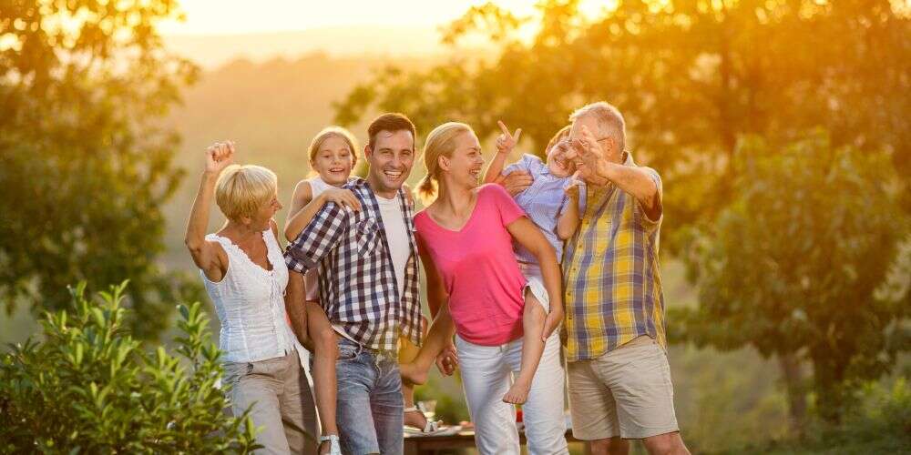 generation family on vacation posing together concept