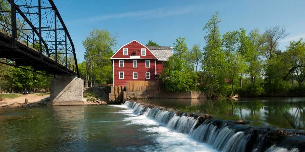 war-eagle-mill-rogers-with-red-mill-house-iron-bridge-and-weir-spring-2022