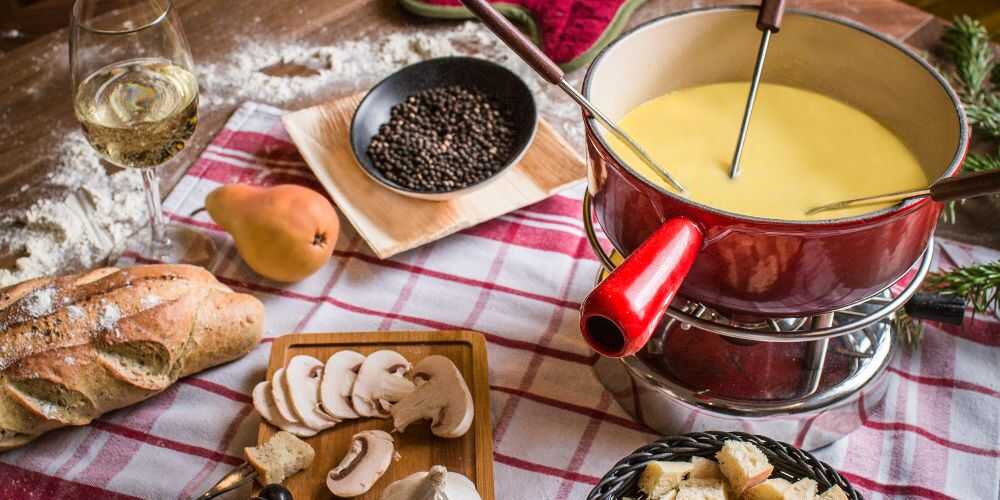 cheese fondue bread wine and charcuterie on Club Med family vacations in Quebec