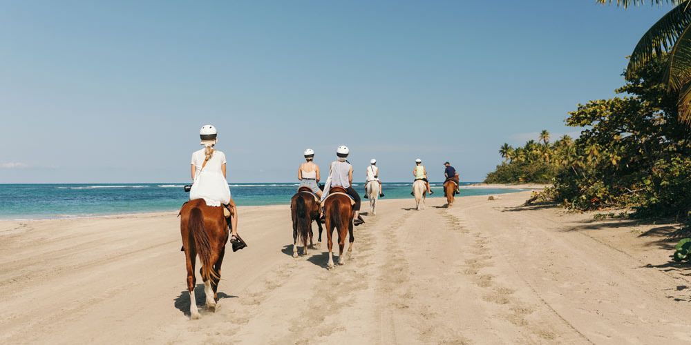 family horseriding with guides on Playa Esmerelda Dominican Republic