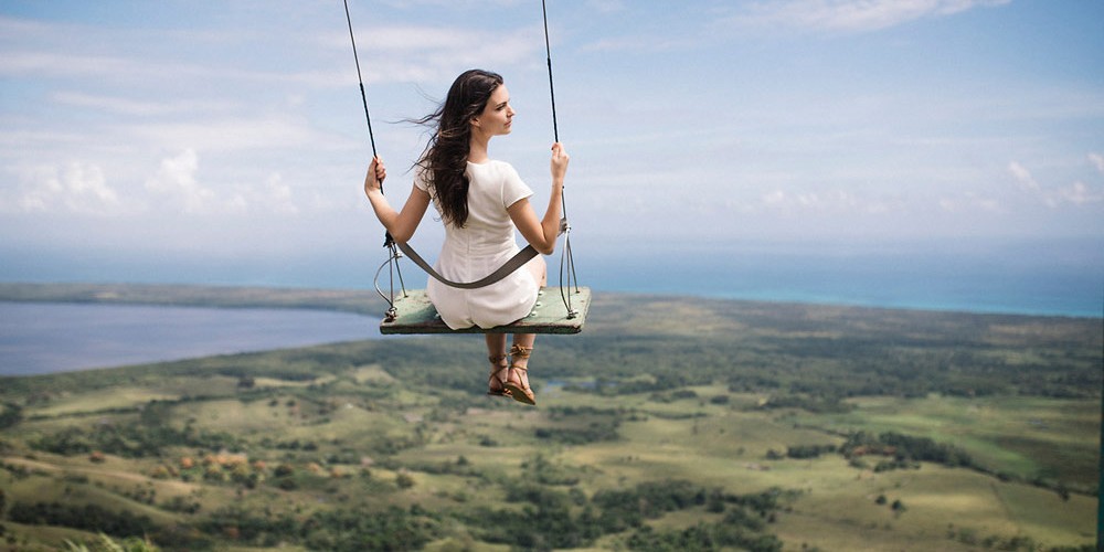 woman on swing on Montana Rodonda Playa Esmerelda Dominican Republic