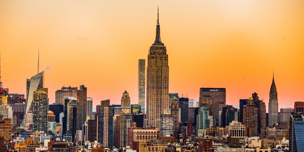 new-york-skyline-sunset-empire-state-building-manhattan-family-trip-savings-getaroom
