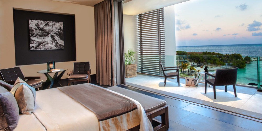 bedroom-ocean-suite-nizuc-resort-and-spa-with-balcony-overlooking-the-caribbean-cancun