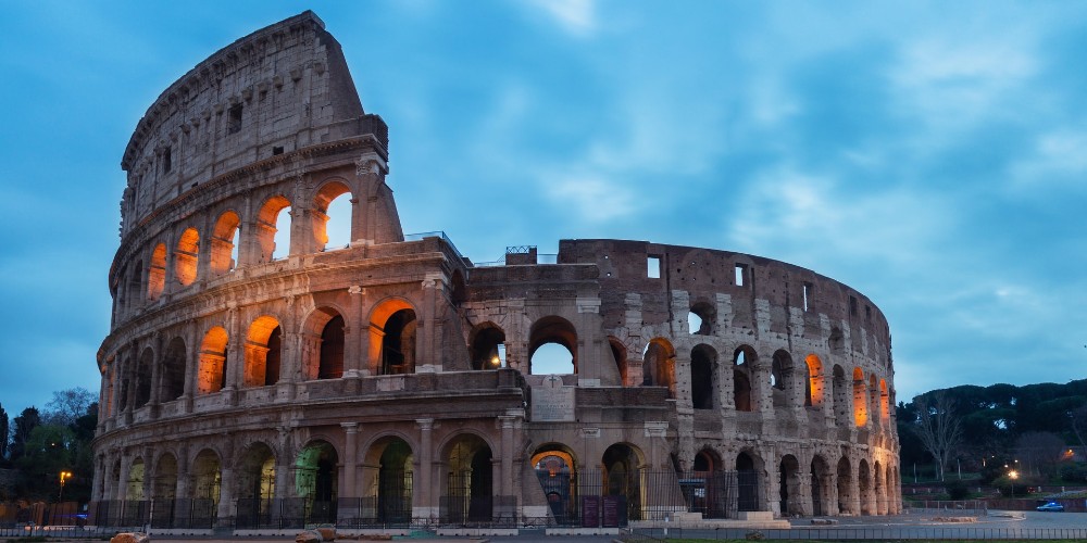 evening-image-of-the-colosseum-rome-floodlit-inside-against-a-blue-dusk-sky-david-kohler 