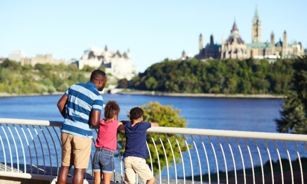 family-looking-at-View-of-Parliament-from-Canadian-Museum-of-History-Ottawa-Tourism-summer-2022