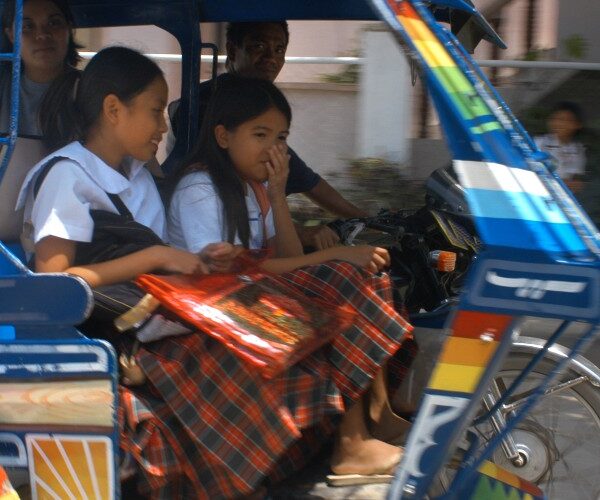 schoolgirls-in-tricycle-taxi-borocay-island-the-philippines-2023
