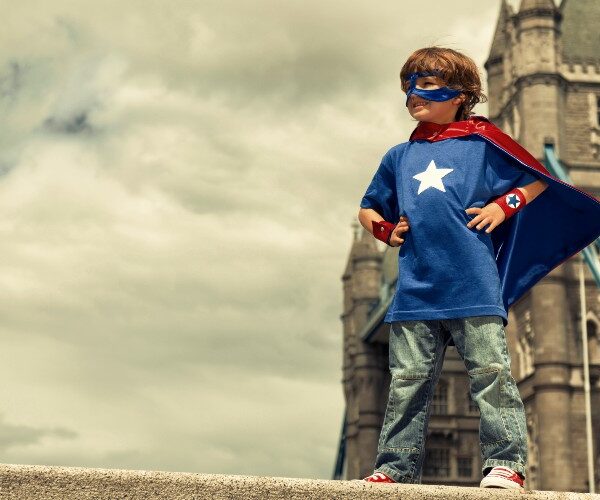 boy-super-hero-costume-tower-bridge-london-family-traveller