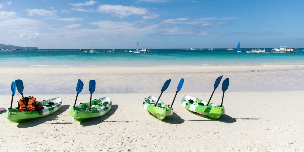 white-beach-with-canoes-island-philippines