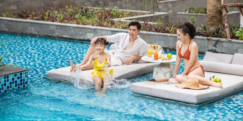 asian-family-young-child-hotel-swimming-pool