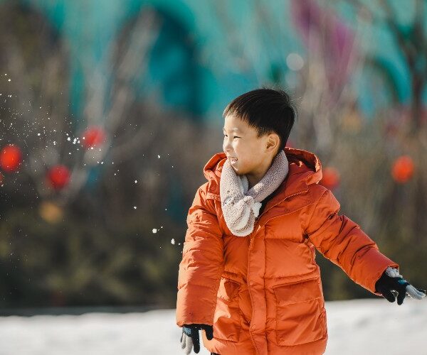 asian-boy-playing-in-snow-suki-lee
