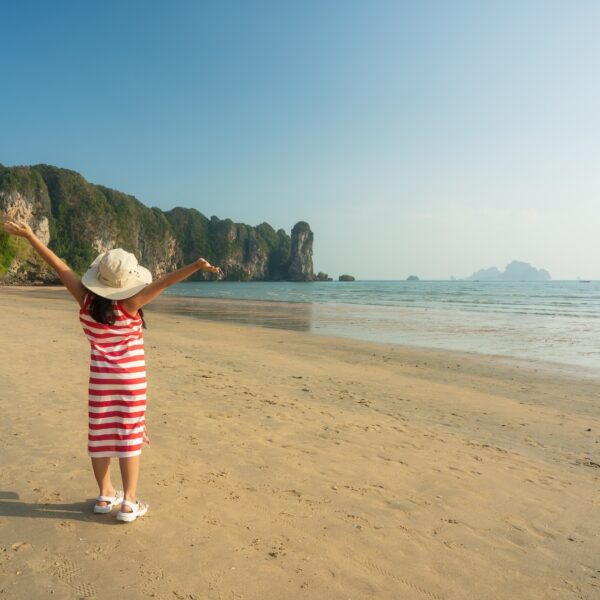 girl-happy-beach-asia