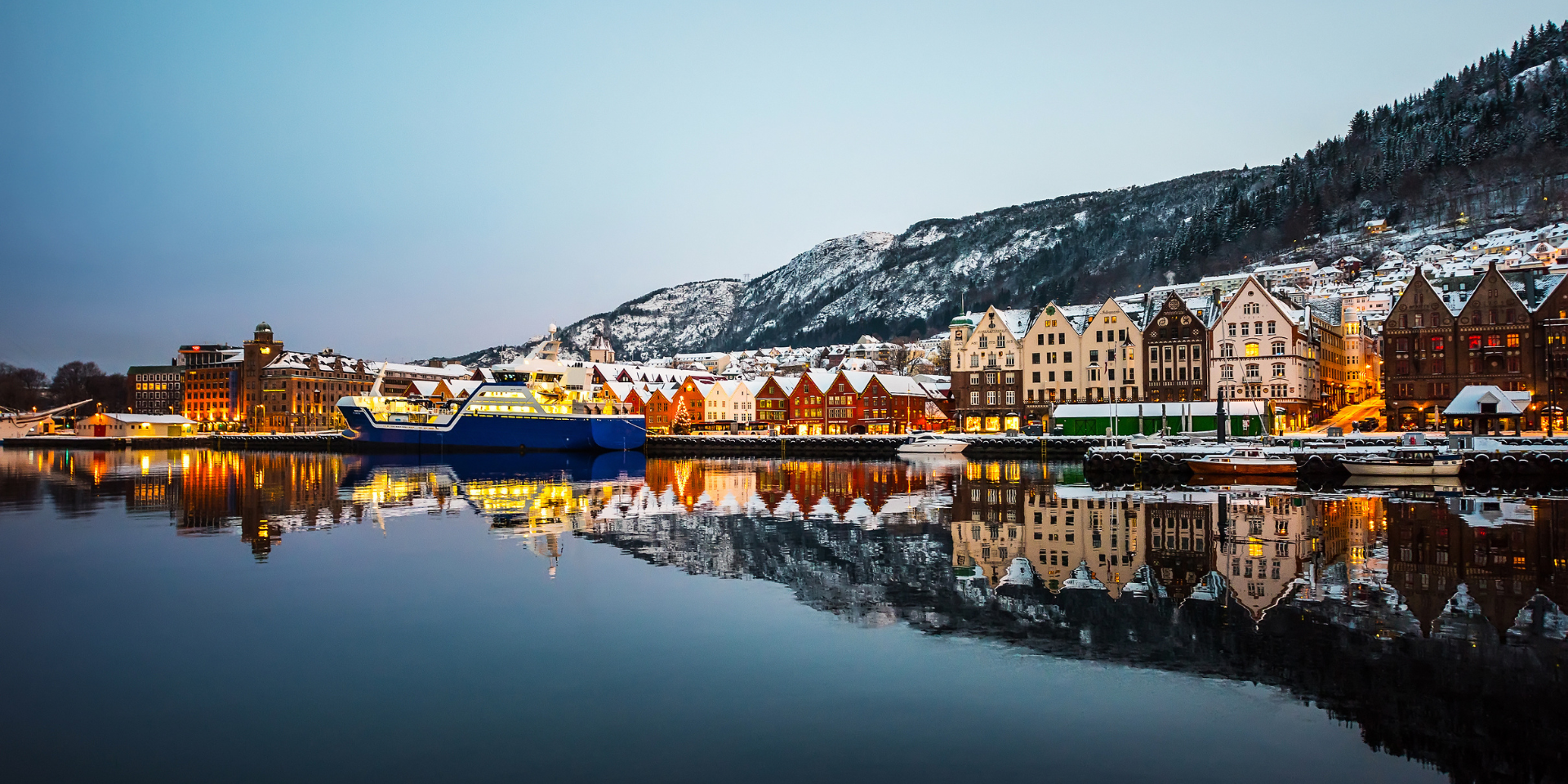 colourful houses by a still lake