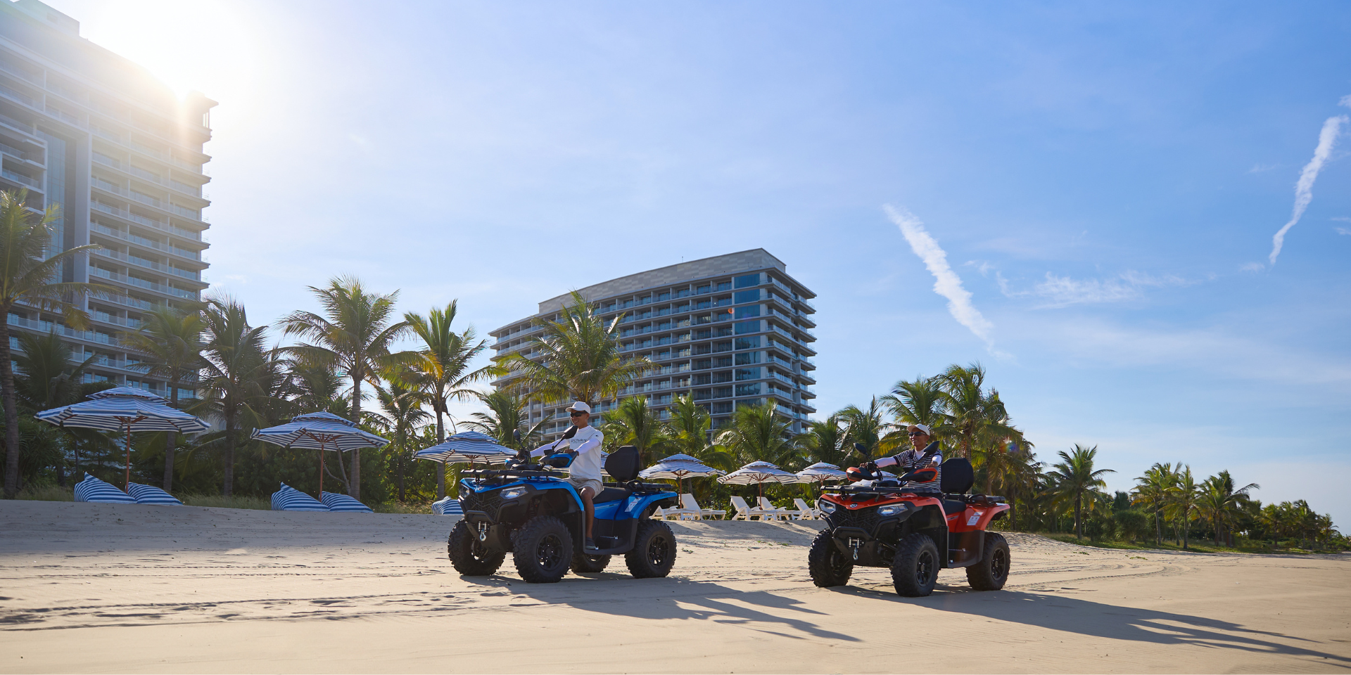 2 ATVs on a sandy beach