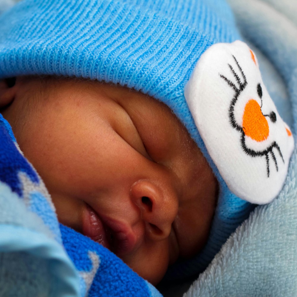 baby-asleep-on-plane-family-travel-hacks