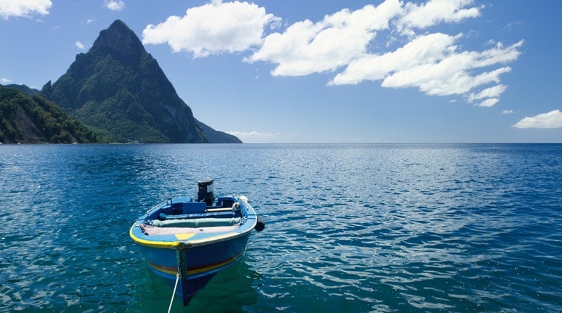 st-lucia-caribbean-boat-on-sea-with-mountains-in-background