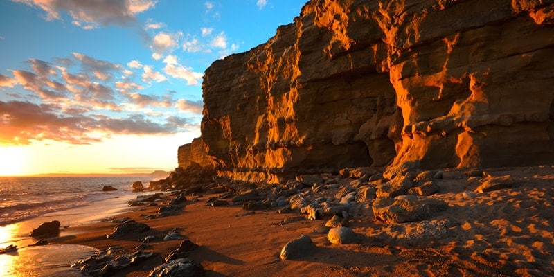 sunset over the yellow cliffs at hive beach