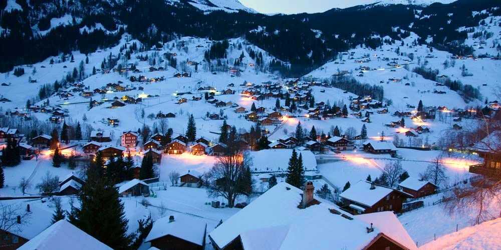 Grindelwald Switzerland snow covered winter village in the Swiss Alps for family holidays