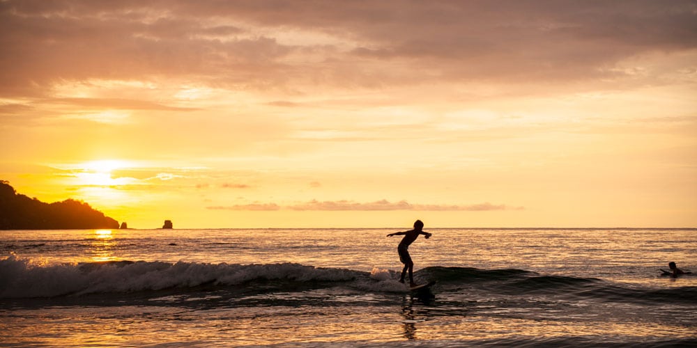 sunset surfing Costa Rica water adventures