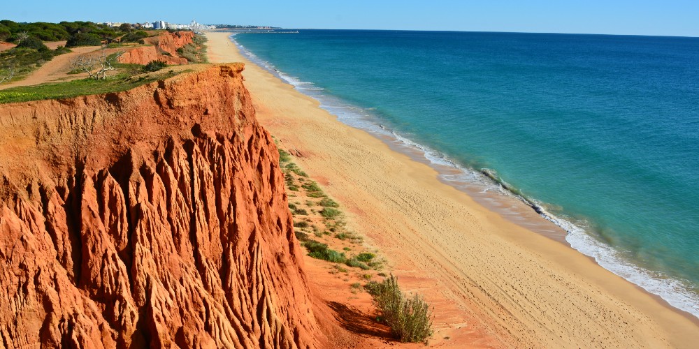 praia-da-falesia-central-algarve-portugal-beach-cliffs-atlantic-blue-skies-2022