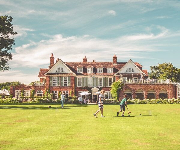 kids-playing-croquet-front-lawn-chewton-glen-hotel-dorset-england-family-traveller-accommodation-guide-2022