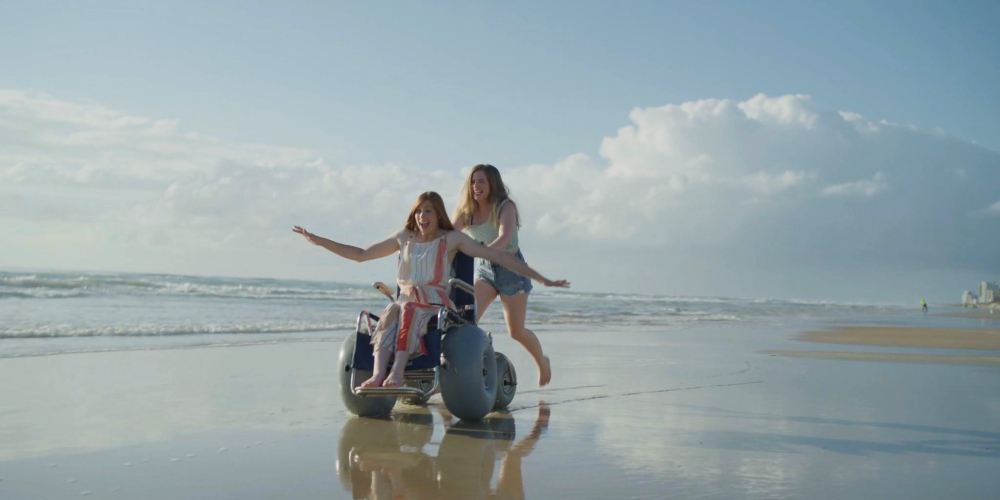 women-enjoying-the-sea-beach-wheelchair-accessible-florida