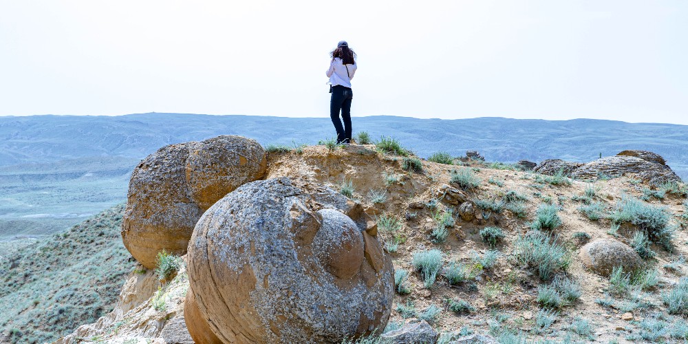 valley-of-the-stone-balls-girl-standing-on-ridge