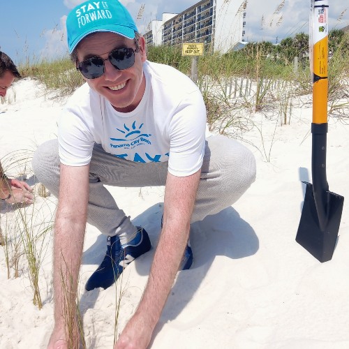 man-planting-sea-oats-northwest-florida