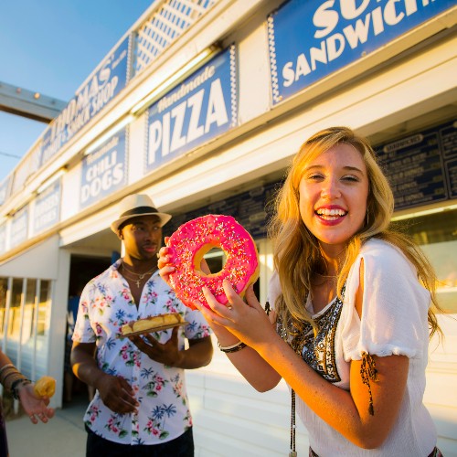 woman-with-donut-thomas-donuts