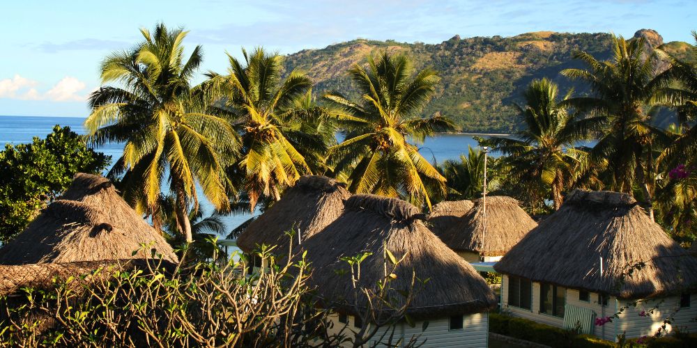thatched-roof-huts-beach-fiji
