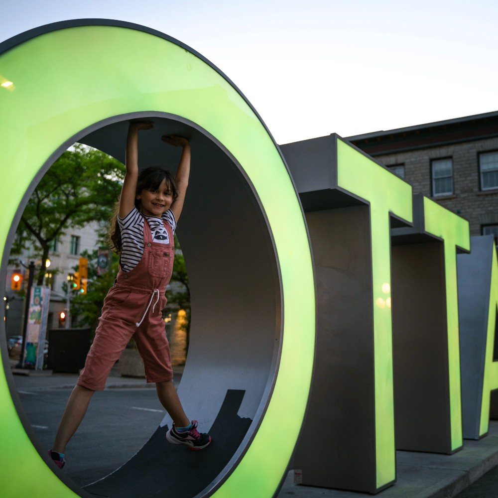 byward-market-ottawa-sign-and-child