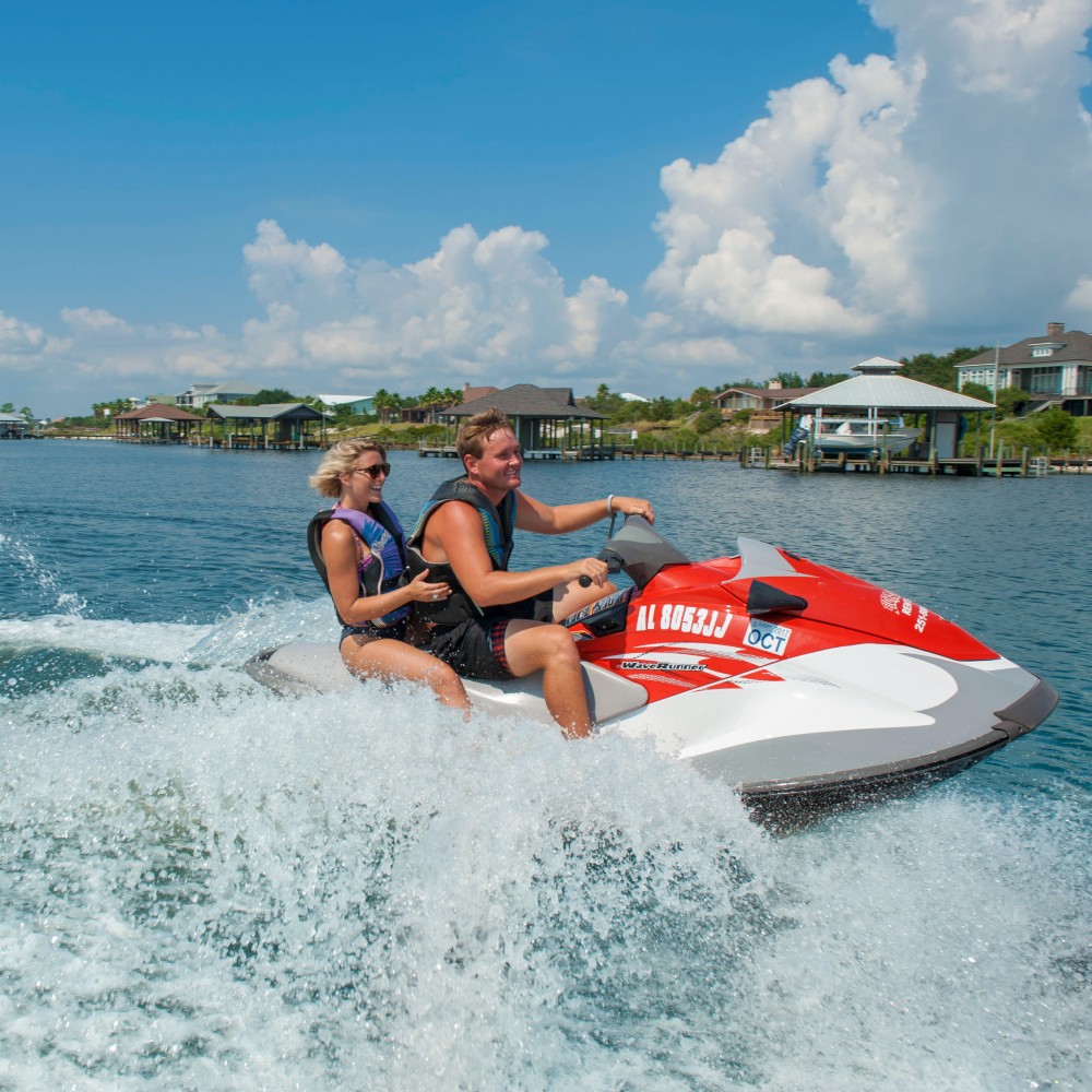 couple-on-jetski-pensacola-family-vacation-northwest-florida